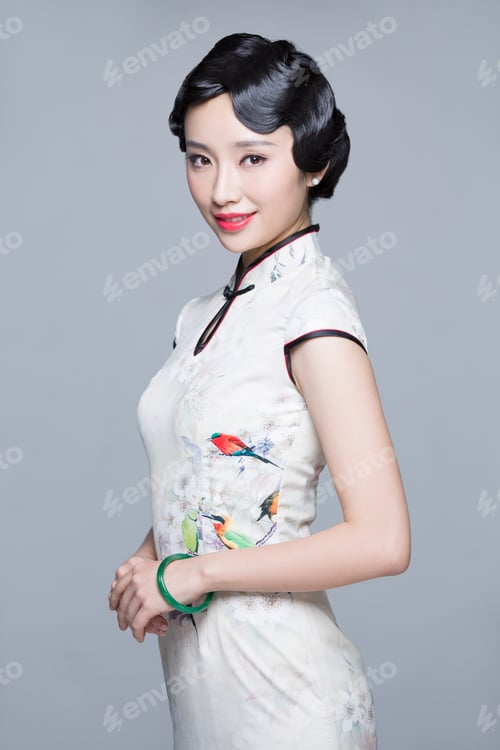 Preview: Portrait of young beautiful woman in traditional cheongsam