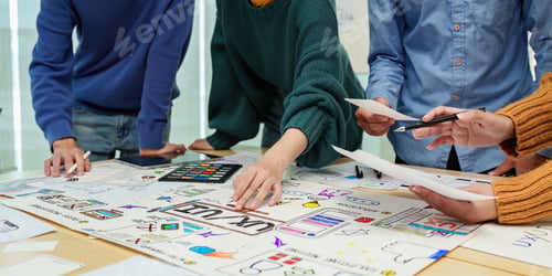 Preview: Close up ux developer and ui designer brainstorming interface wireframe design.Creative digital