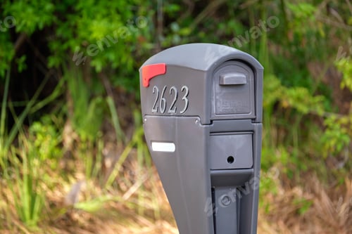 Preview: Typical american outdoors mail box on suburban street side
