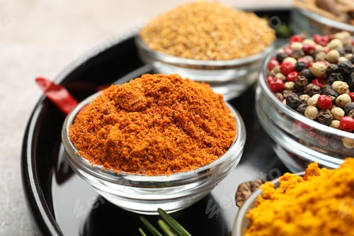 Preview: Different aromatic spices on light grey table, closeup