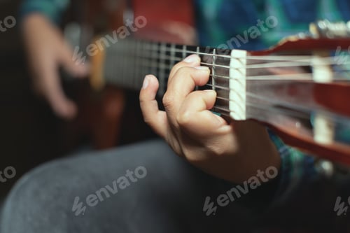 Preview: Left hand detail with chord on classical guitar