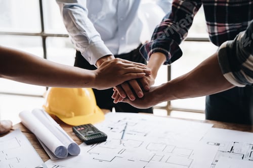 Preview: Businessman handshake with engineering in construction renovate building site. Engineer/architect in