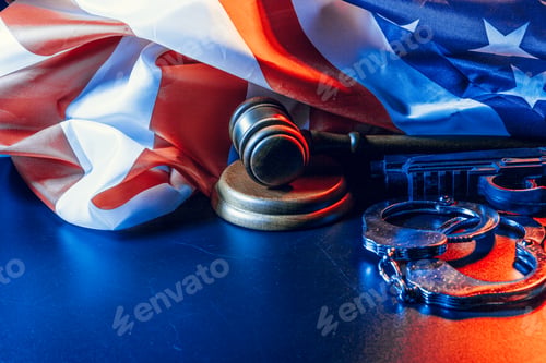 Preview: Gavel, handcuffs and american flag on dark background