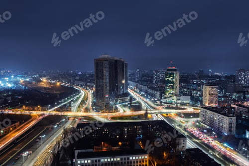Preview: Aerial panoramic drone above roof view of Kiev night traffic road junction scene. Highway city at