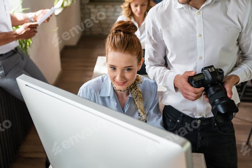 Preview: Creative startup young multiethnic business people working together at designer agency in office