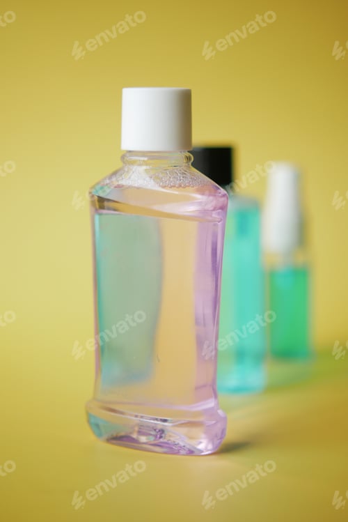 Preview: mouthwash liquid in a container on table