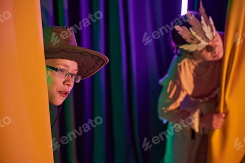 Preview: Young Girl in Cowboy Hat Peeking on Stage in Childrens Theater