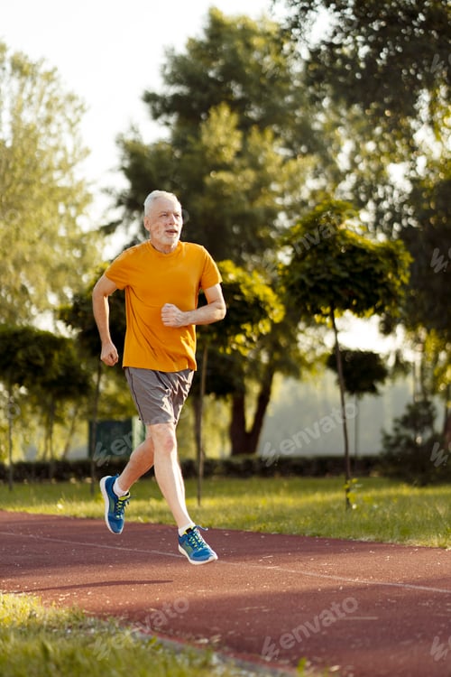 Preview: Senior man running in a park maintaining healthy lifestyle