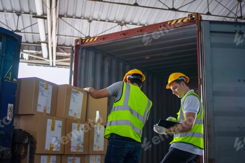Preview: Blue collar workers are working at warehouse.