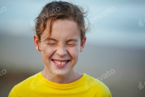 Preview: Laughing child with eyes closed tight