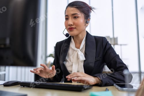 Preview: Operator agent with headsets working in a call center giving help as a customer service officer
