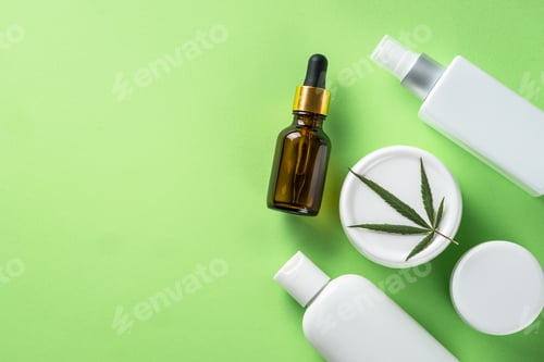 Preview: Cannabis cosmetic products on green background top view