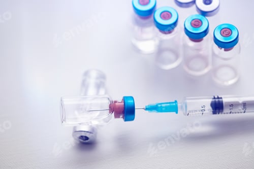 Preview: Close up on vaccine and medical syringe