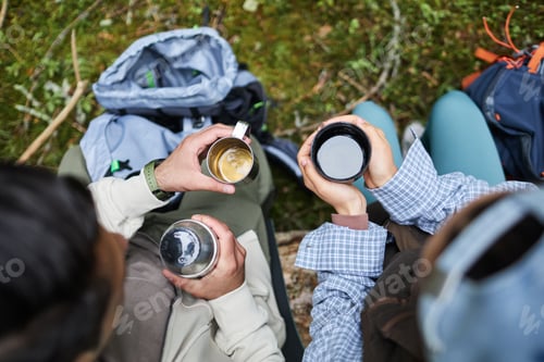 Preview: Young Adult Multiethnic Friends Drinking Coffee Outdoors during Hiking Trip