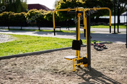 Preview: Outdoor gym equipment in a park setting on a sunny day