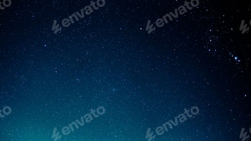 Preview: Stunning night sky featuring a blend of blue and green hues, illuminated by twinkling stars