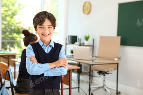 Preview: Boy wearing new school uniform in classroom