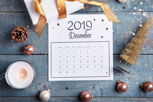 Preview: Flat lay composition with paper calendar on blue wooden table
