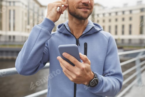 Preview: Man using phone outdoors