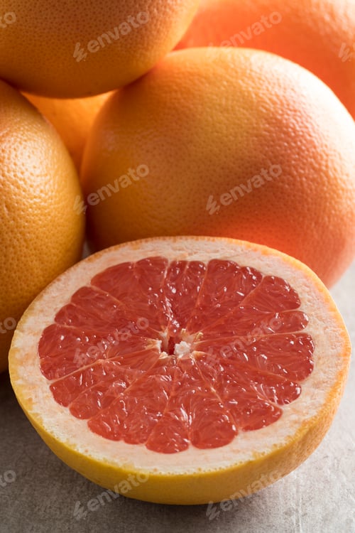 Preview: Whole and halved red grapefruit
