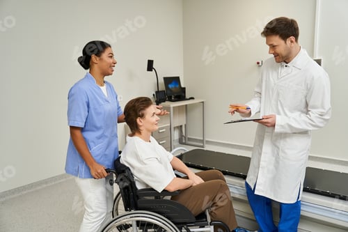 Preview: Healthcare teamwork in action with doctor and nurse preparing patient for MRI scan