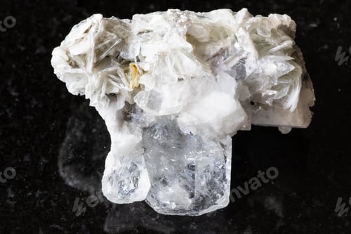 Preview: Goshenite with mica and feldspar mineral on black