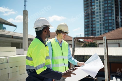 Preview: Architect and construction engineer or surveyor discussion plans and blueprints