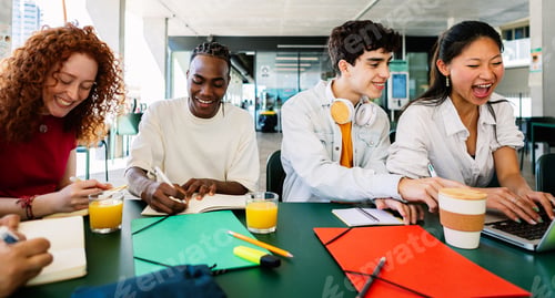 Preview: High school teenage students studying together at campus.