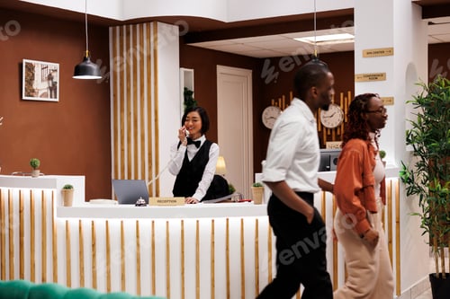 Preview: Asian receptionist making online booking