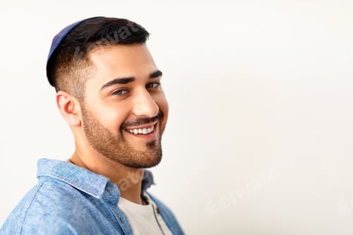 Preview: Closeup headshot portrait of smiling jewish man in kippa