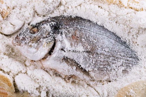 Preview: Preparing salt-baked dorada fish top view