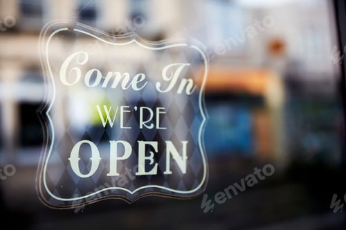 Preview: A sign etched in glass, Come In, We're Open.