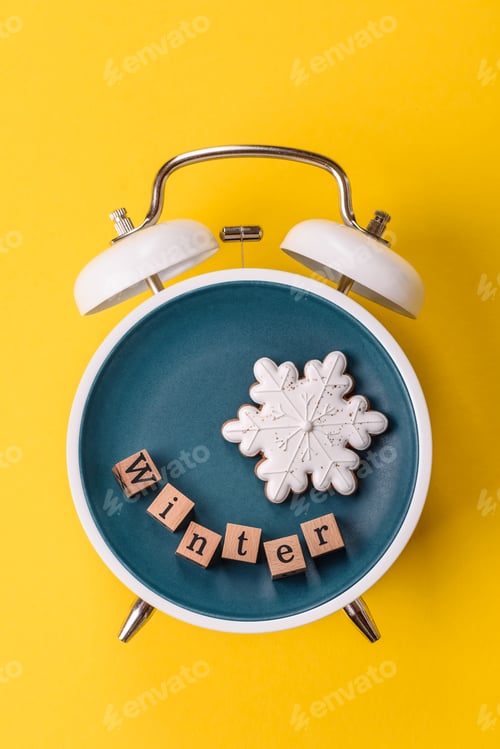 Preview: Christmas, gingerbread or biscuits on a plate on a clock. Christmas time conceptual background