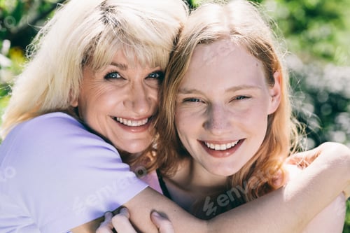 Preview: Older woman hugging young woman