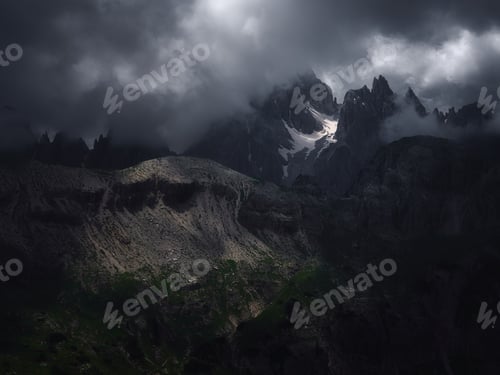 Preview: Cadini di Misurina in darkness illuminated by sunlight, Dolomites, Italy