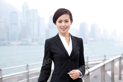 Preview: Elegant businesswoman in Victoria Harbor, Hong Kong