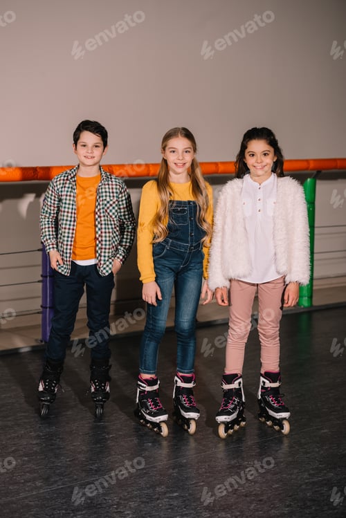 Preview: Full length shot of glad kids practicing on roller rink