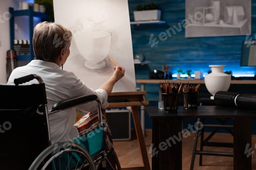 Preview: Old woman with disability creating drawing of vase from table