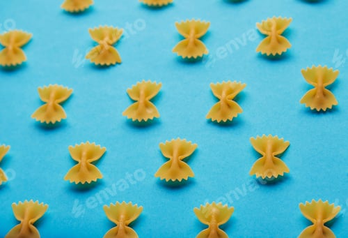 Preview: italian Farfale pasta pattern on blue background side view