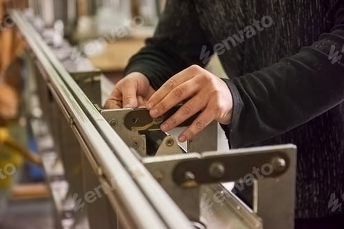 Preview: Man is screwing a bolt.