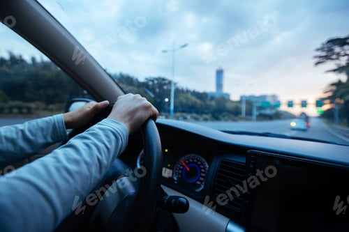 Preview: People driving car on sunrise city road
