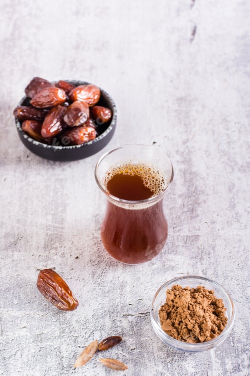 Preview: Alternative coffee from ground date seeds on the table. Avoiding caffeine. Vertical view