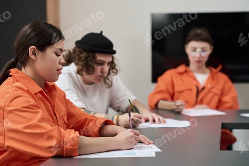 Preview: Young Adult Prisoners Attending Educational Class and Writing