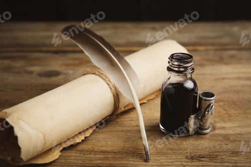 Preview: Feather pen, bottle of ink and parchment scroll on wooden table