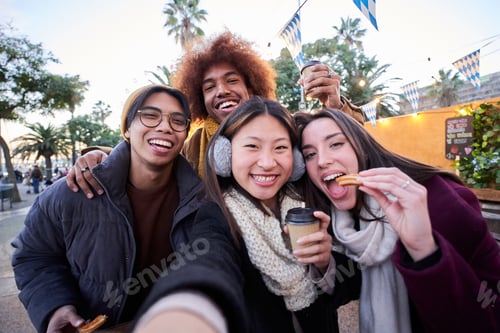 Preview: Selfie phone looking camera of cheerful friends eating chocolate churros street food stall at city.