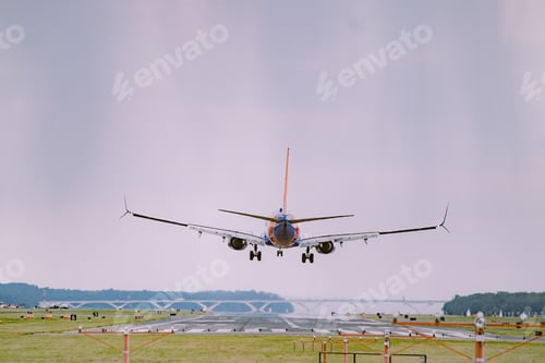Preview: Airplane in flight in a cloudy sky