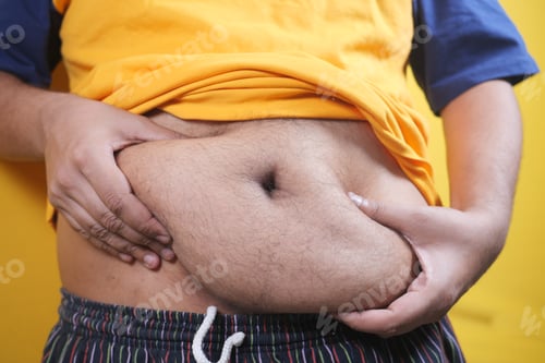 Preview: young men holding his belly fat