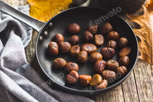 Preview: Peeled chestnuts. Sweet roasted chestnuts on pan.