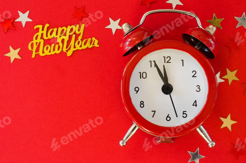 Preview: Festive Christmas background with alarm clock on red background in minimal style.