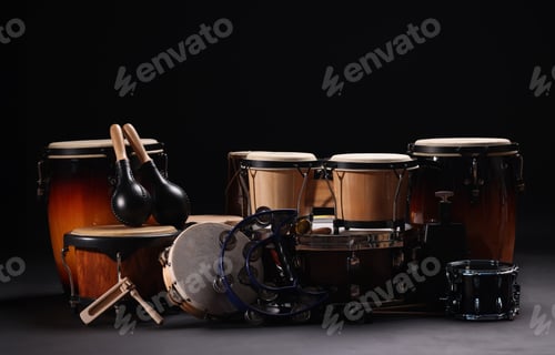Preview: Different drums on a black background, percussion musical instruments.